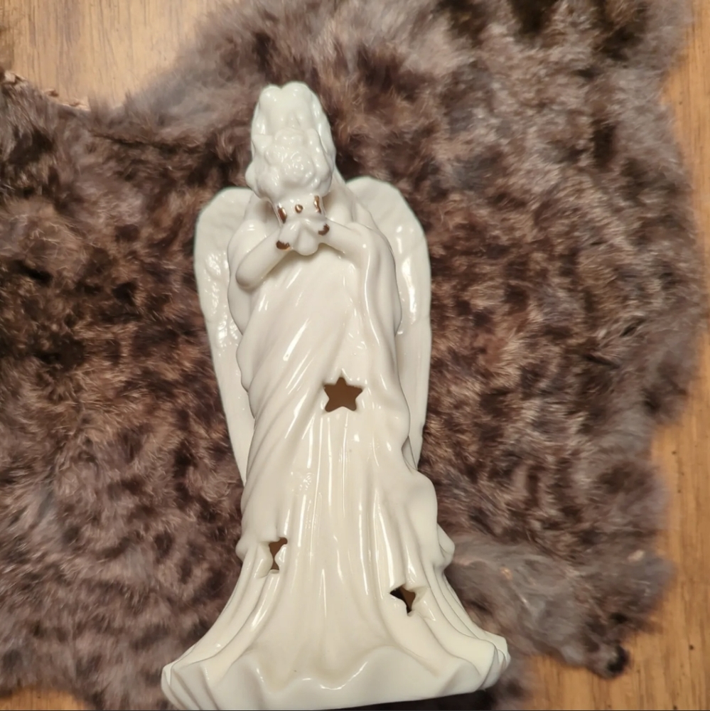 Porcelain tea light angel holder with bouquet